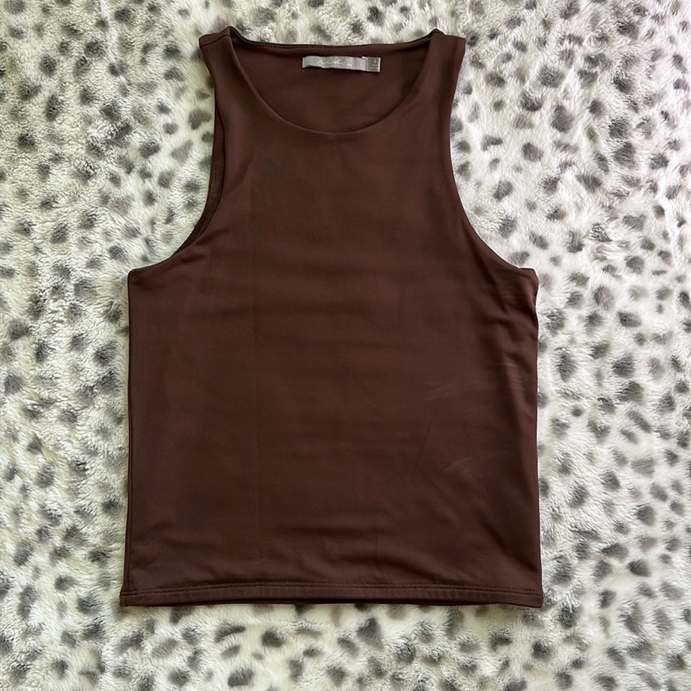 The shirt is from the buckle it is brown size small